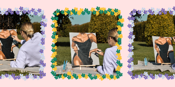 A woman sitting on a blanket outdoors, painting a canvas that depicts a figure in a black dress. 