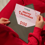 ArtSpark gift card held over a Christmas envelope