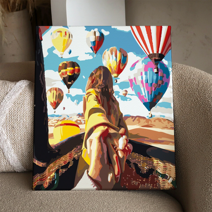 Romantic painting of a couple with hot air balloons overhead
