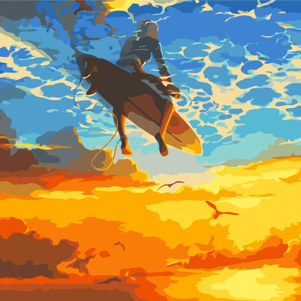 Surfer soaring above the ocean with a vibrant sunset sky