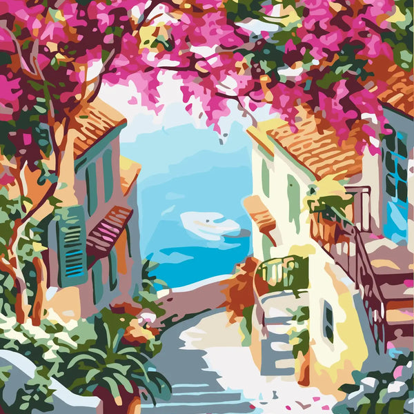 Colorful Mediterranean village street with flowers overlooking the sea