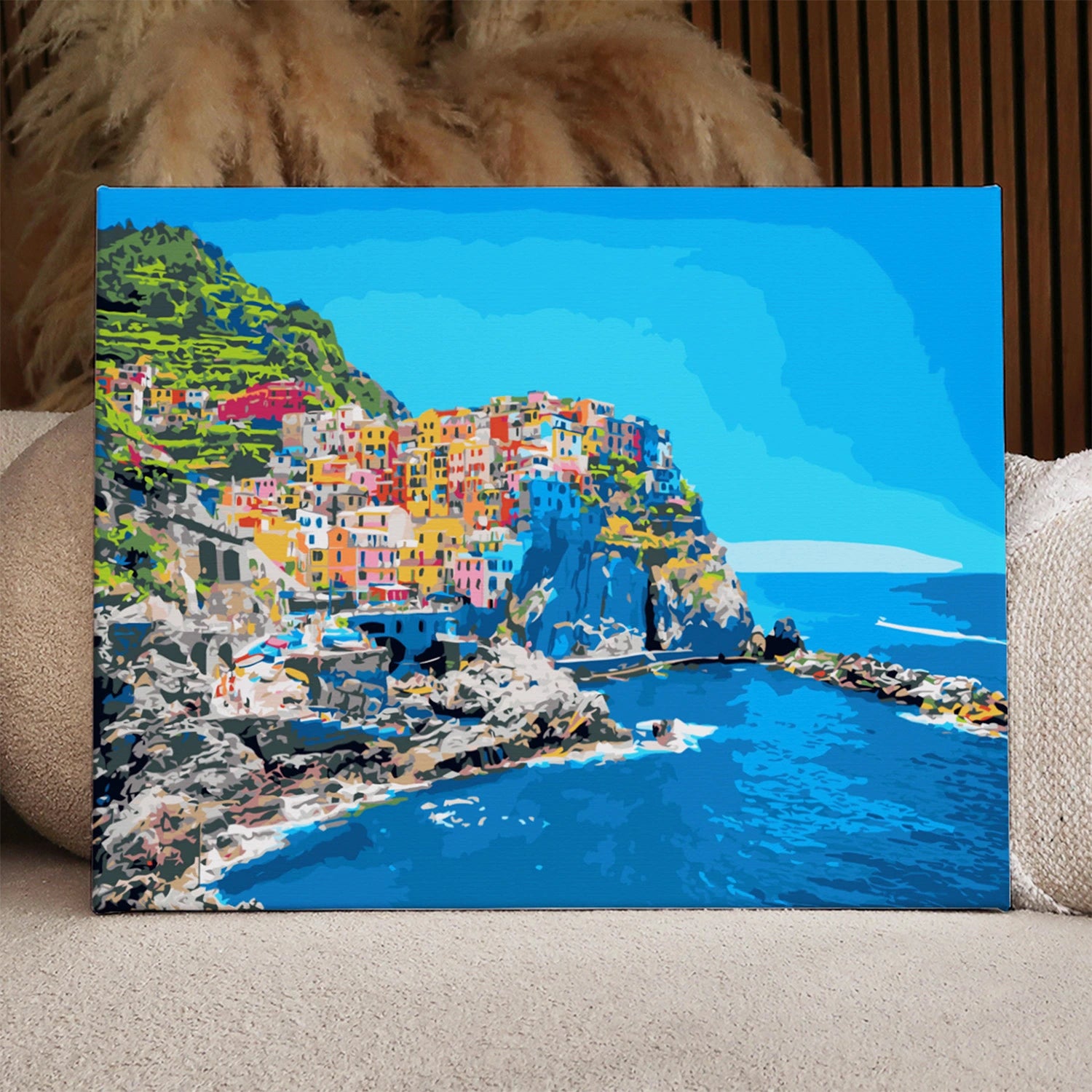 Colorful coastal village on cliffs overlooking the deep blue sea