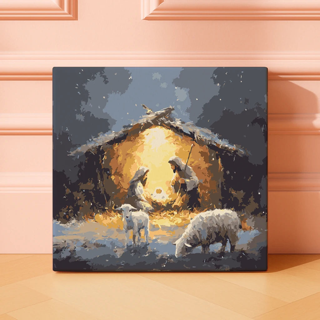 Finished Holy Snowfall paint by numbers artwork depicting a glowing Nativity scene on a snowy night