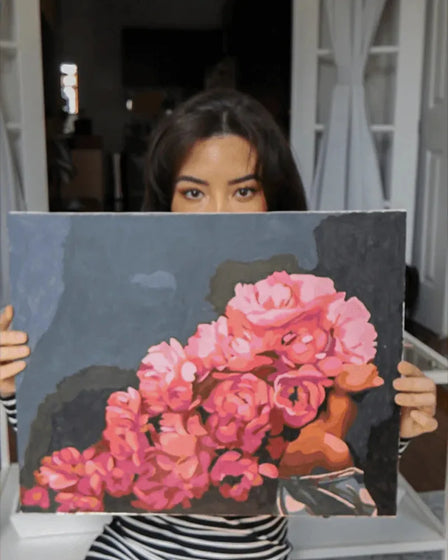 ArtSpark customer with their finished paint by numbers canvas