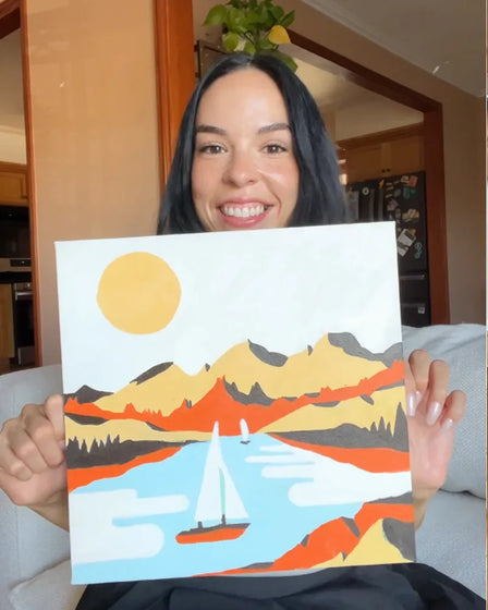 ArtSpark customer with their finished paint by numbers canvas