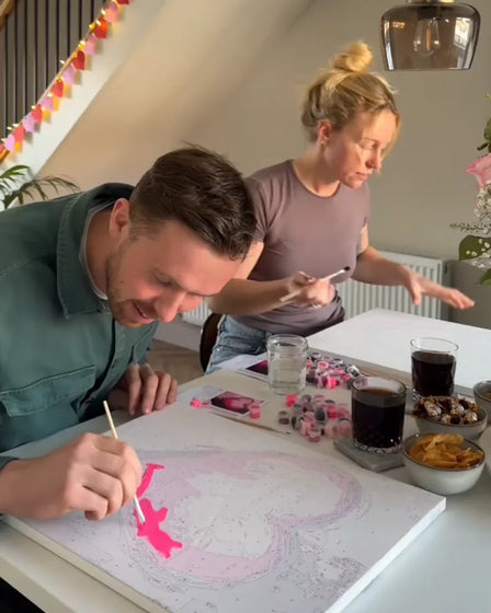 ArtSpark customer with their finished paint by numbers canvas