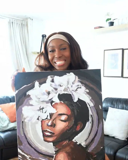 ArtSpark customer with their finished paint by numbers canvas