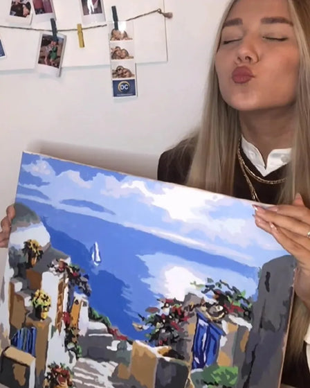 ArtSpark customer with their finished paint by numbers canvas