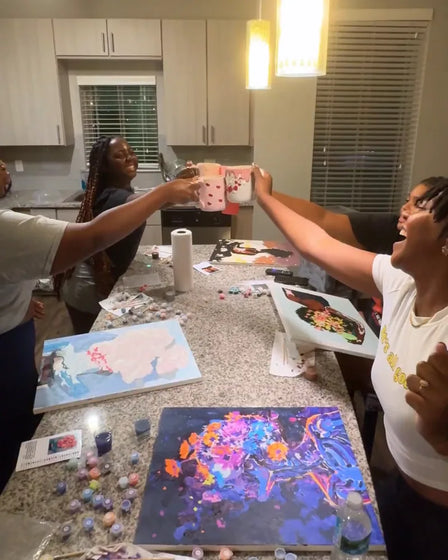 ArtSpark customer with their finished paint by numbers canvas