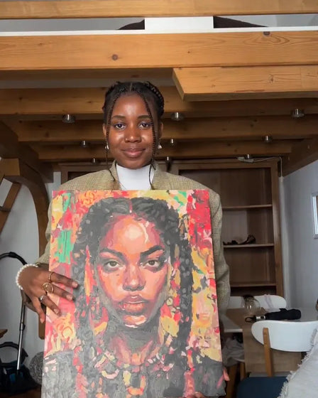 ArtSpark customer with their finished paint by numbers canvas