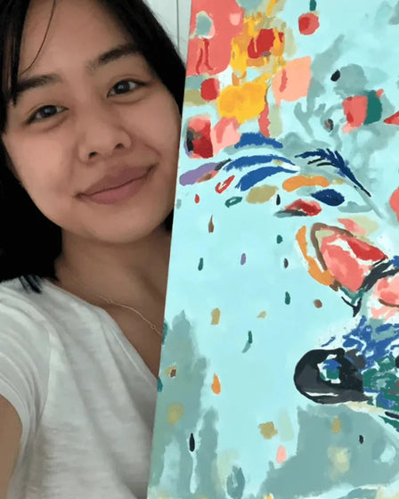 ArtSpark customer with their finished paint by numbers canvas