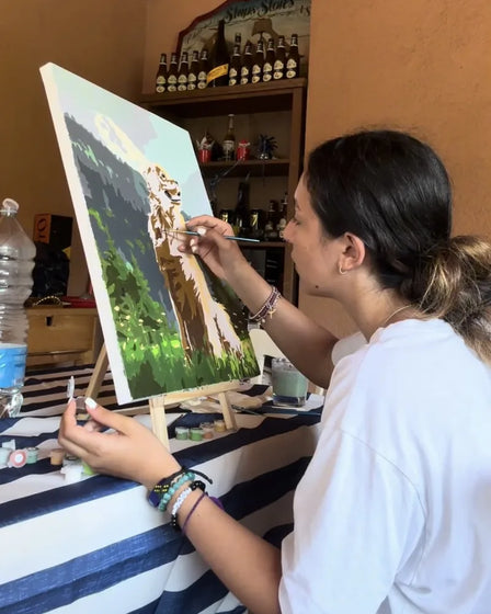 ArtSpark customer with their finished paint by numbers canvas