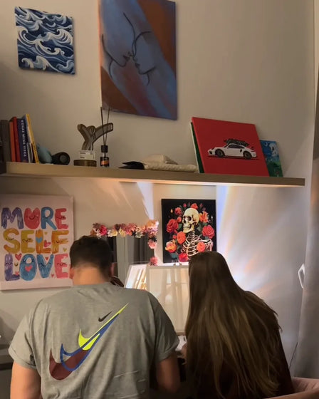 ArtSpark customer with their finished paint by numbers canvas