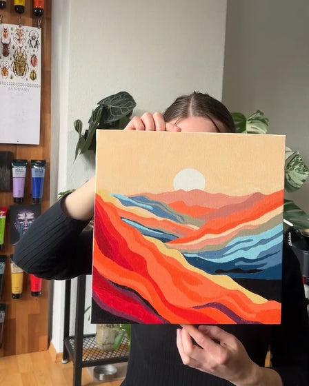 ArtSpark customer with their finished paint by numbers canvas