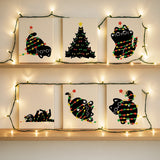 Completed Black Cat’s Lights paint by numbers mini canvases by Artspark featuring cute black cats tangled in Christmas lights for a festive look.