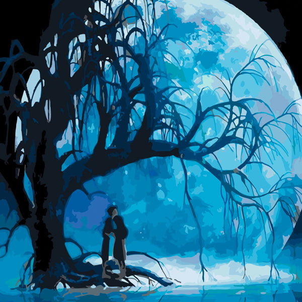 Silhouetted couple under eerie tree with glowing blue full moon