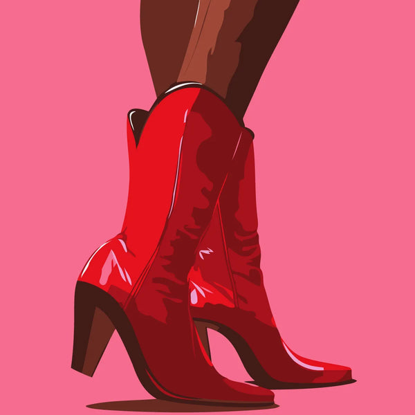 Stylish red cowboy boots on a woman's legs against pink background