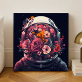 Flowernaut paint by numbers finished canvas, an astronaut helmet full of pink and orange flowers, standing on a wooden floor by a white wall