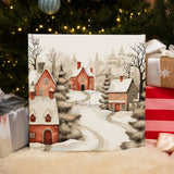 Completed It’s Snowing paint by numbers artwork showing a peaceful snow-covered village with warm glowing homes.