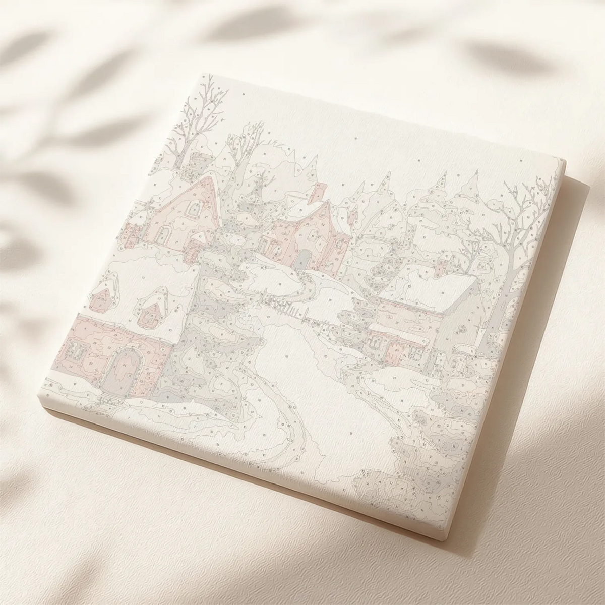 It’s Snowing paint by numbers canvas showing a snowy village with cozy cottages and trees.