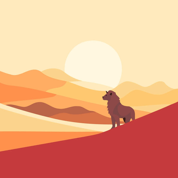 A lion standing on a hill against a desert sunset