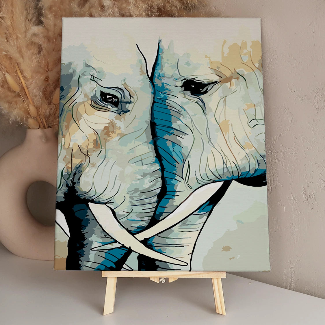 Close-up painting of two elephants touching faces in unity