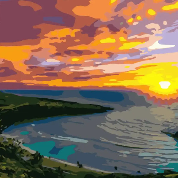 Vibrant sunset over an ocean bay with lush green hills