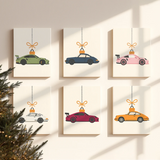 Completed Merry Drive paint by numbers mini canvases by Artspark featuring colorful sports cars as hanging Christmas ornaments — modern wall art for holiday enthusiasts.