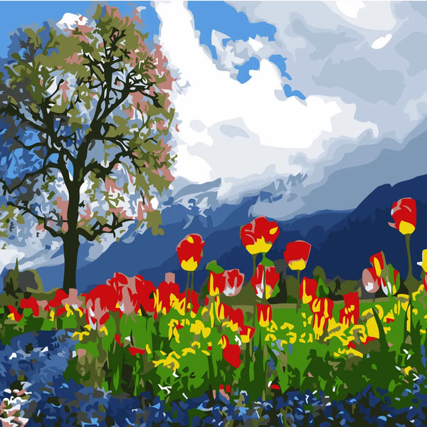 Vibrant tulip field with a tree and mountain backdrop