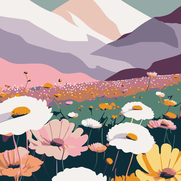 Colorful wildflowers blooming in a valley beneath snow-capped mountains