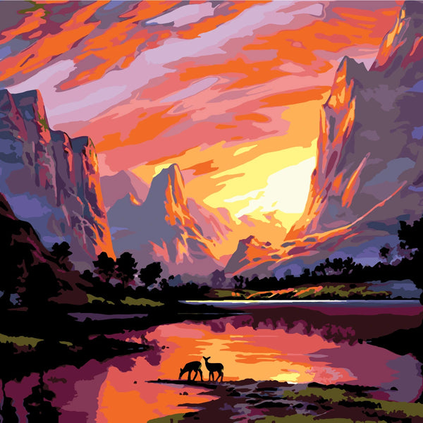 Majestic sunset over mountains with deer by a reflective lake