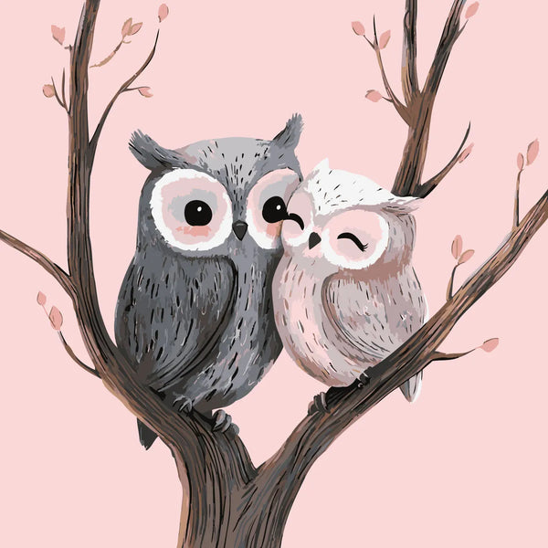 Two adorable owls cuddling on a tree branch with blossoms