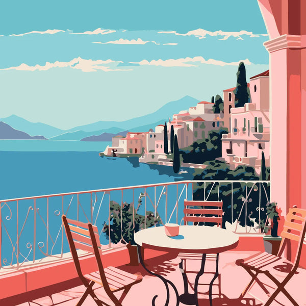 Scenic coastal terrace with chairs overlooking a Mediterranean village