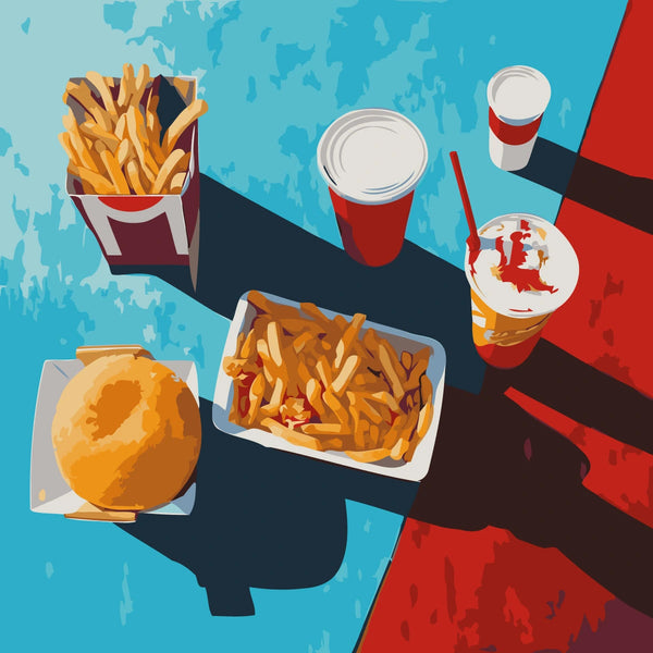 Fast food meal with fries burger and drinks on colorful table
