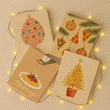 Completed Snackmas paint by numbers canvases by Artspark showing colorful pizza ornaments, fry tree, and pasta plate — playful Christmas wall art for food and art lovers.