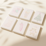 Sweet Noel paint by numbers set of 6 pastel Christmas mini canvases by Artspark featuring nutcracker, Christmas tree, stocking, and gingerbread cookie designs ready to paint.