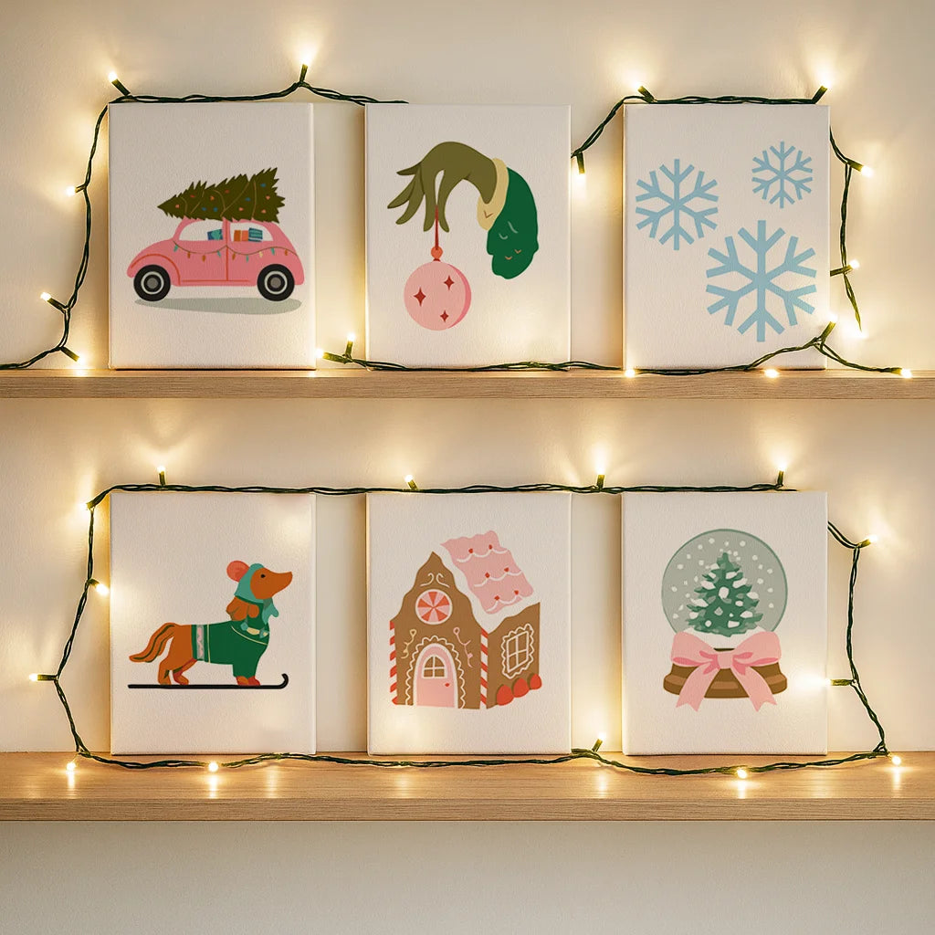 Completed Whimsical Holiday paint by numbers canvases by Artspark showing pastel festive scenes like a dachshund on skis, snow globe, and gingerbread house — modern cozy wall art.