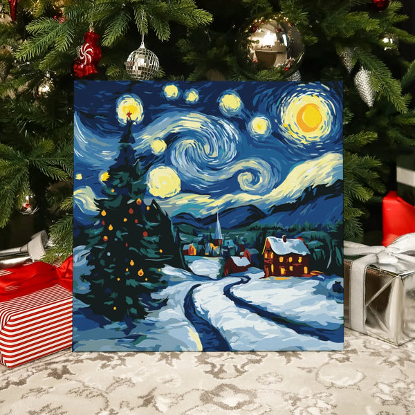 Completed Winter Village paint by numbers by Artspark showing a snowy Christmas village with a starry sky and festive lights.