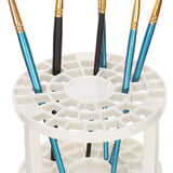 White paint brush holder stand with multiple brushes – ideal for drying and organizing art tools in a creative workspace