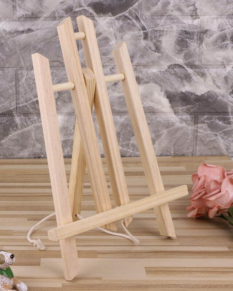 Assembled pine easel on desk with flowers – great for paint-by-numbers