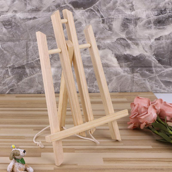 Assembled pine easel on desk with flowers – great for paint-by-numbers